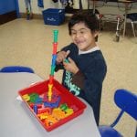 students working with pegs