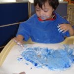 student finger painting