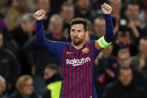 image of Messi wearing a jersey and holding his arms up as if he were cheering