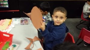 We are creating our jack-o-lanterns using ripped orange paper glued onto a pumpkins shaped piece of brown paper.