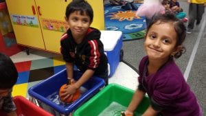 We are washing pumpkins to remove any soil before painting.