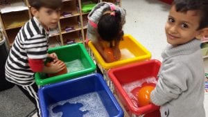 We are washing pumpkins to remove any soil before painting.