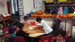 We are creating our jack-o-lanterns using ripped orange paper glued onto a pumpkins shaped piece of brown paper.