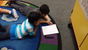 Students are sharing the fact they illustrated before writing the words to match.