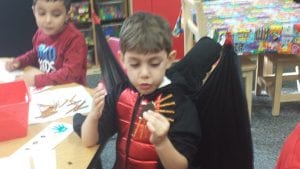 We made spider cookies with Oreos and pretzel sticks.