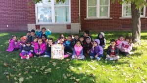 We read "We're Going on a Leaf Hunt" by Steve Metzger outside.