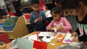 We cut and glued paper holiday cookies onto a pretend tray and added the cookies to create a number model!