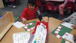 We used squares and rectangles to make candy canes! we recorded the number of squares and rectangles we used.