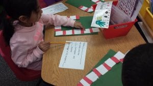 We used squares and rectangles to make candy canes! we recorded the number of squares and rectangles we used.