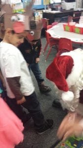 Santa is tying our shoes!