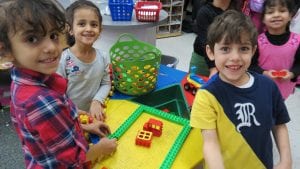 Making conversation with our friends and learning to share during inside recess!