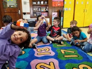 Counting to four with one to one correspondence and recognizing what a quantity of 4 looks like. 