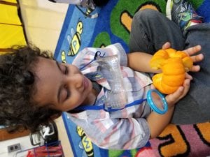 We are using the magnifying lens to see what is inside of the tiny pumpkin.