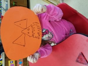 We made a jack-o-lantern mask after tracing triangles!