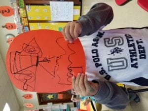 We made a jack-o-lantern mask after tracing triangles!