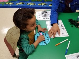 We are matching the quantity with the number during Spider Math Spin!