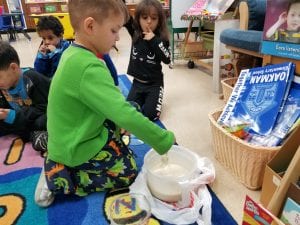 We are mixing the batter to make pancakes for letter P!