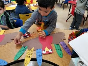 We are practicing showing the quantity to match the number for our Ten Frame Turkeys!