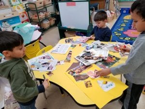 We are practicing finding pictures of things we need to live in magazines!!!