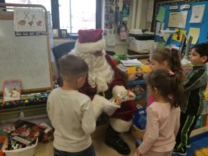 We showed Santa a book where he is a character.