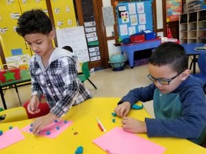 We practiced identifying the number of sides of 2D shapes. We used toothpicks and playdough balls to construct 2D shapes!