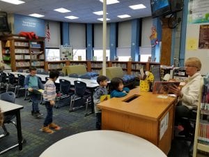 Ms. Shrieve helped us check out new library books!
