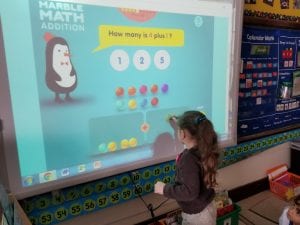 We are learning to take turns as we count the marbles for the addends to add to find the sum in Marble Math.