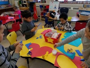 We are practicing fine motor skills as we cut, glue, and accordion fold to create our heart people!