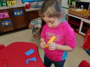 We are practicing fine motor skills as we cut, glue, and accordion fold to create our heart people!