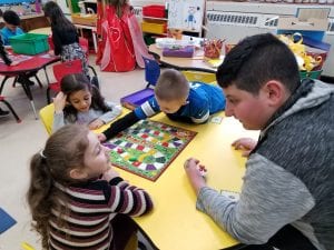 Our friend from Mrs. Gartha's class came and introduced a new math game that reinforced number recognition, counting with one to one correspondence, and turn taking!