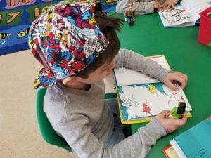 We read Dr. Seuss books to our toy buddies!