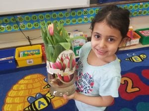 We are learning about living things! I brought in tulips that were not yet bloomed. The children kept watch....after a couple of days...they bloomed!!!! Plants are living things!