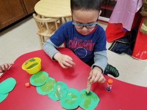 We used clothespins and puff balls to paint our caterpillars!