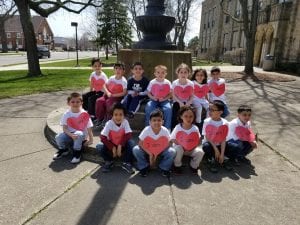We care about our friends! We are sitting with one of our new friends from Ms. Rawson's class!