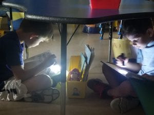 We did read to someone under the tables with flashlights!