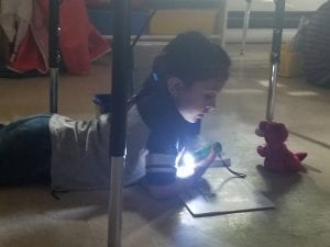 We did read to someone under the tables with flashlights!