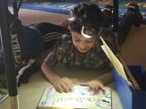 We did read to someone under the tables with flashlights!