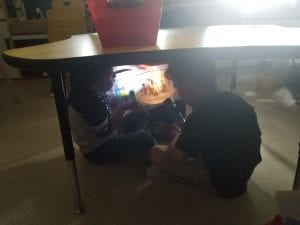 We did read to someone under the tables with flashlights!