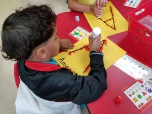 We used dabbers to create the letters our first names begin with.