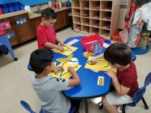 Then....we strengthened our fine motor muscles in our hands by placing small stickers on those letters!