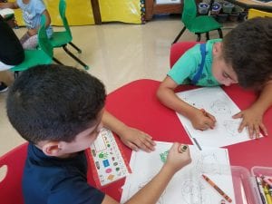 We practiced our first comprehension strategy of naming the characters in a story. We listened to "The Three Little Pigs". 