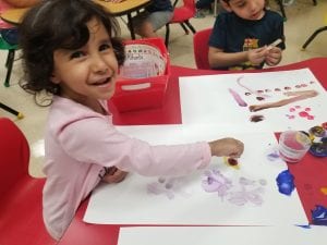We used clothespins with puff balls on the end to paint our unique masterpieces! We hung these pieces of art up in our room!