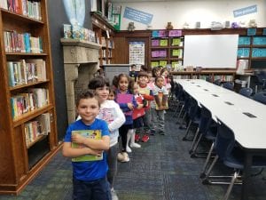 We practiced the rules of the library and how to walk safely while holding our books!