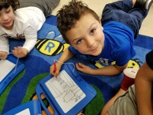 We practiced drawing our ideas on our magic boards to plan for our narrative writing about a time we got a new toy.