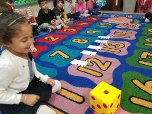 We practiced fluency of quantity recognition by rolling the dice and matching the quantity shown with its number card.
