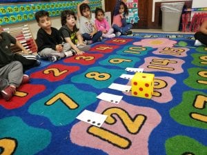 We practiced fluency of quantity recognition by rolling the dice and matching the quantity shown with its number card.