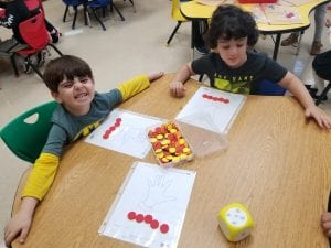 Here we are matching the quantity shown with our hand mat for fluency!