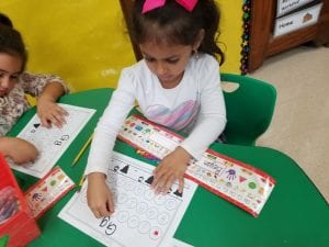 We practiced the sound for the letter Gg as we placed and sticker on the Ggs and said, "/g/ /g/ G, put a sticker on me!"