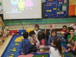 We turned to our buddy to share what we name each of the colored monsters on the board. 
