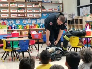 The firefighters taught us about the special equipment they wear that helps them stay safe in a fire rescue.